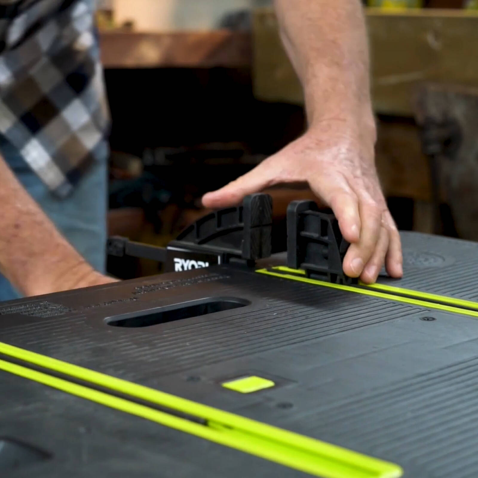 Ryobi Folding Work Table with Two Clamps, 850 x 550mm Plastic Surface