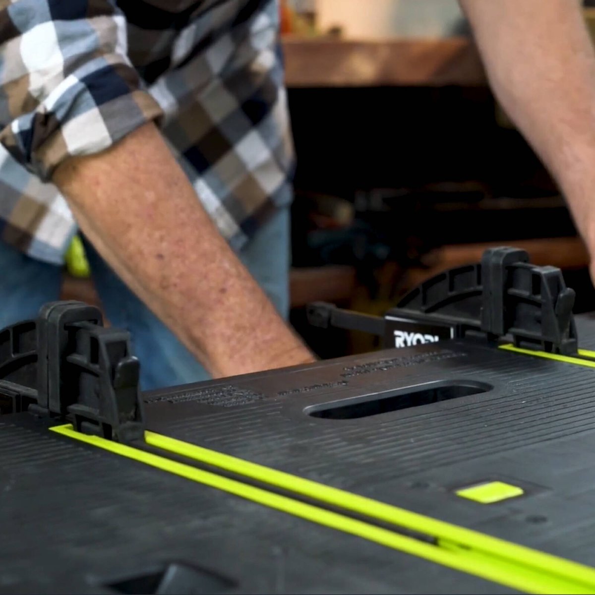 Ryobi Folding Work Table with Two Clamps, 850 x 550mm Plastic Surface