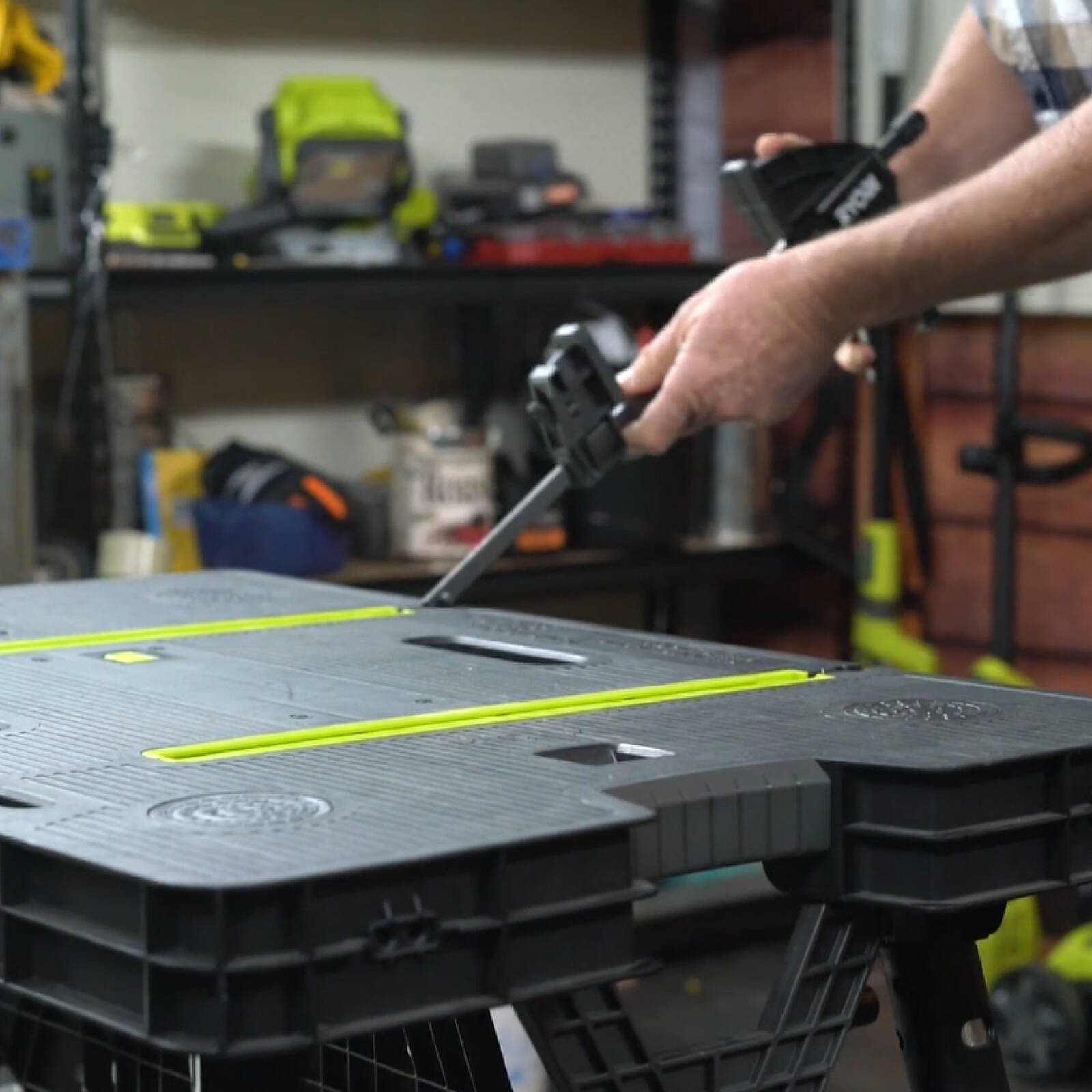 Ryobi Folding Work Table with Two Clamps, 850 x 550mm Plastic Surface