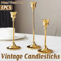 3 Piece Vintage Gold Metal Candlestick Set with Different Heights