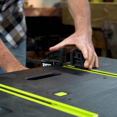 Ryobi Folding Work Table with Two Clamps, 850 x 550mm Plastic Surface