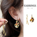 Asymmetric Gold Paint Palette and Brush Drop Earrings with Enamel Accents