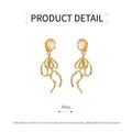 French Retro Gold Tone Long Drop Earrings with Pearl Accent and Swirl Design - view 3