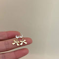 Gold Bow Pendant Earrings with Clear Heart Crystal Top - view 5